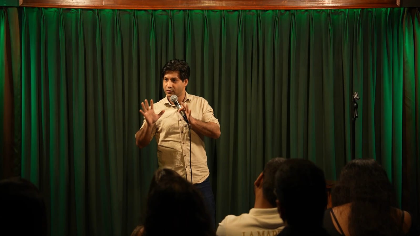 Late night comedy club seating and vibrant lighting